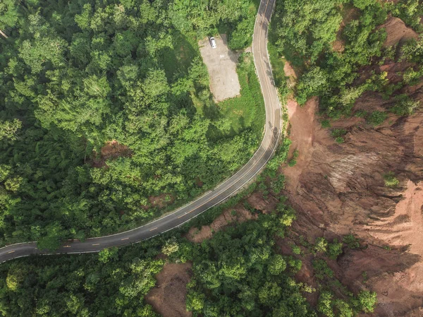 Top View of Rural Road, Path through the green forest and countr