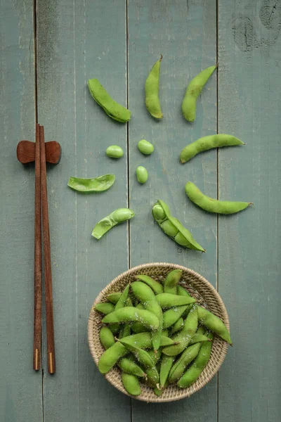 Green Japanese Soybean in wooden bowl on table wood — Stock Photo, Image