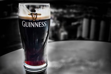 DUBLIN, IRELAND - FEBRUARY 7, 2017: A pint of Guinness on a stand clipart