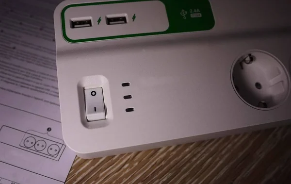 Electric surge protector  Close-up and power supply details. Used at home and in the office