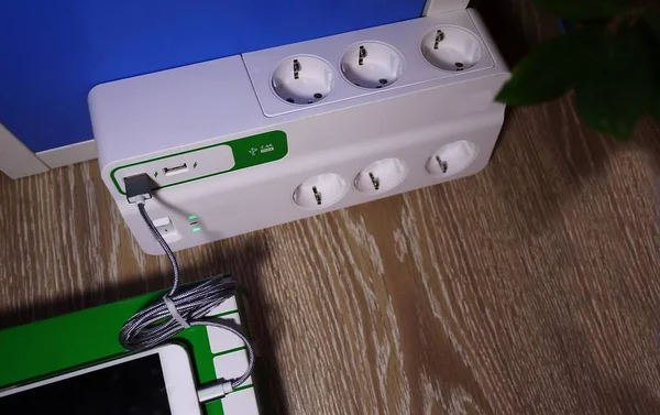 Electric surge protector  Close-up and power supply details. Used at home and in the office
