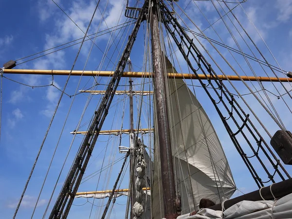 Wooden sailing ship is on the sea. Details and close-up. Sunny weather at sea.