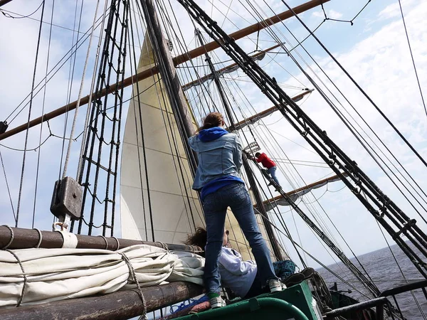 Wooden sailing ship is on the sea. Details and close-up. Sunny weather at sea.