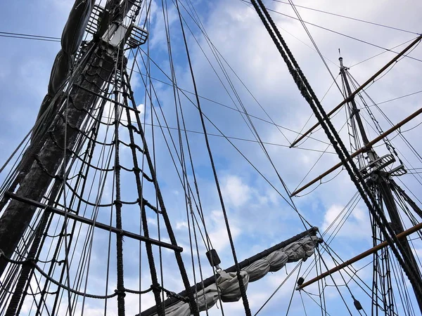 Wooden sailing ship is on the sea. Details and close-up. Sunny weather at sea.