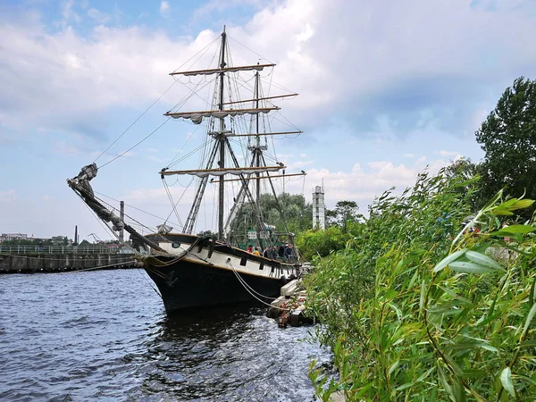 Wooden sailing ship is on the sea. Details and close-up. Sunny weather at sea.