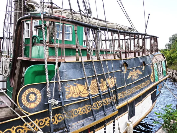 Wooden sailing ship is on the sea. Details and close-up. Sunny weather at sea.