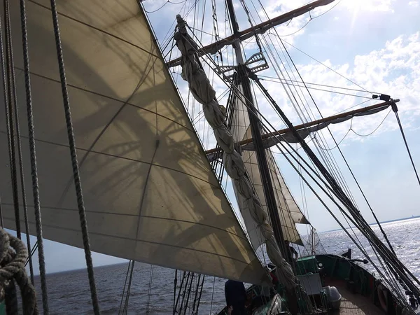 Wooden sailing ship is on the sea. Details and close-up. Sunny weather at sea.