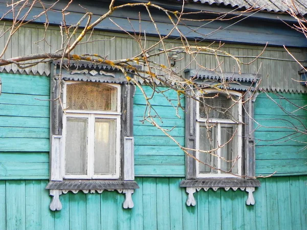 Platbands in the old village, a Russian village in the hinterland of Russia, details and close-up.