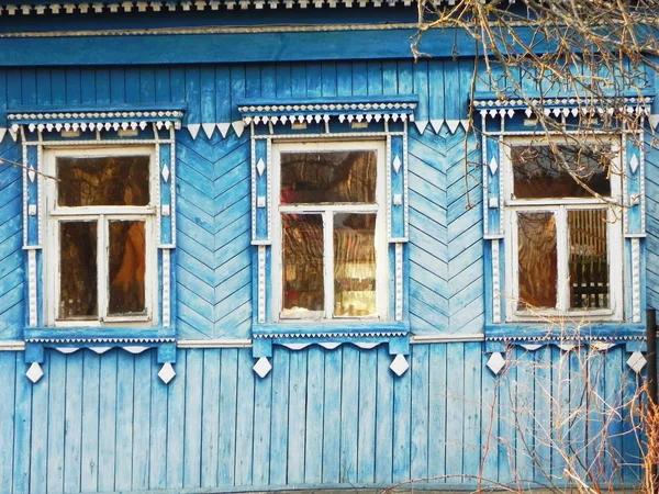 Platbands in the old village, a Russian village in the hinterland of Russia, details and close-up.