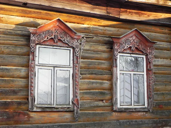 Platbands in the old village, a Russian village in the hinterland of Russia, details and close-up.