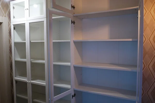 Bookcase with bookshelves. Details and close-up.