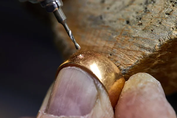 Jewelry production. The process of drilling holes in the ring.