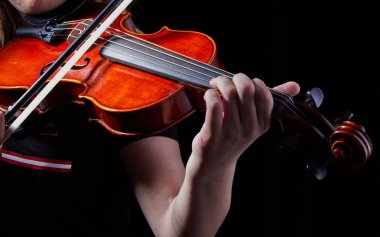 Violin classic musical instrument. Classic player hands on a black background. Details of violin playing clipart