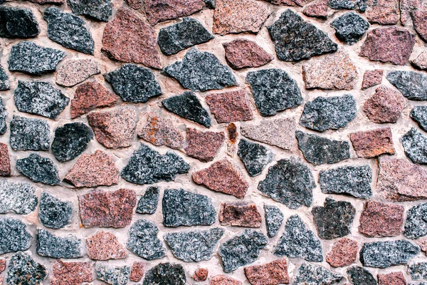 Hintergrund Steinmauer. Tapete eines alten Zauns mit Stein und — Stockfoto
