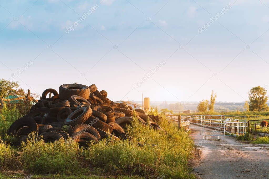 Polluted environment with old used car tyres