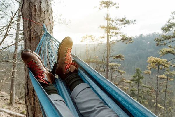 Man relaxing lying in hammock on top of mountain. — Stock Photo, Image