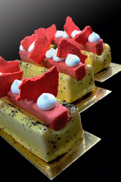 Colorful yellow and red desserts with meringues