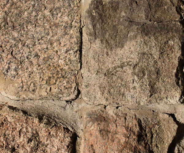 Parede de tijolo de pedra texturizada antiga cimentada juntos fundo — Fotografia de Stock