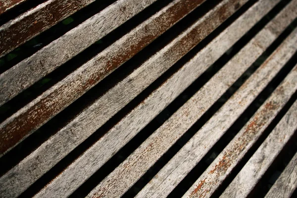 Aged weathered peeling gray wooden plank bench background — Stock Photo, Image