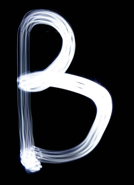 Handwrite letter B, made with light painting technic isolated on black. Light effect font of full alphabet set of upper case letters.