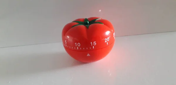 Pomodoro timer - mechanical tomato shaped kitchen timer for cooking or studying. — Stock Photo, Image