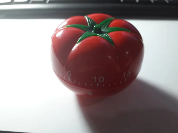 Pomodoro timer - mechanical tomato shaped kitchen timer for cooking or studying. — Stock Photo, Image