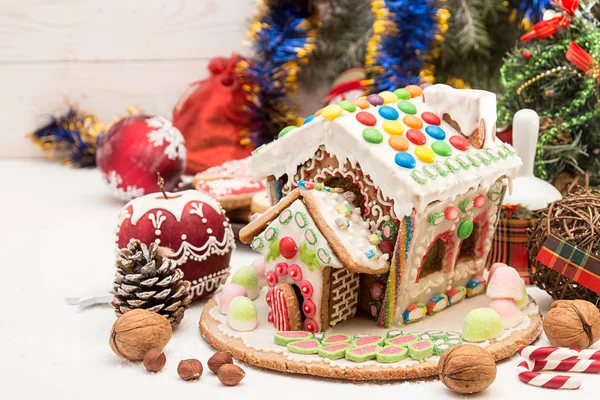 Gingerbread house. Christmas holiday sweets. European Christmas holiday traditions. Christmas gingerbread house and holiday decorations. Copy space.