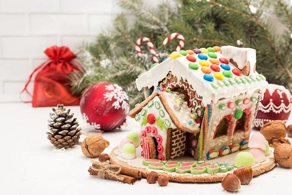 Gingerbread house. Christmas holiday sweets. European Christmas holiday traditions. Christmas gingerbread house and holiday decorations. Copy space.