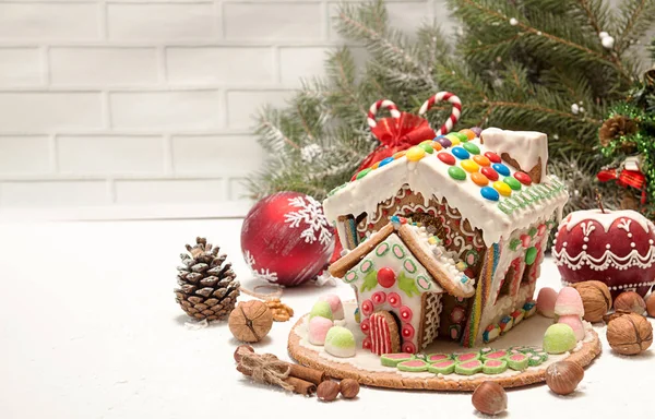 Gingerbread house. Christmas holiday sweets. European Christmas holiday traditions. Christmas gingerbread house and holiday decorations. Copy space.