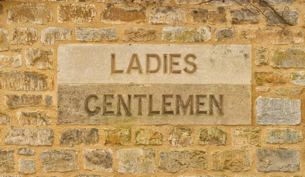 Ladies Gentlemen Carved Stone Sign — Stock Photo, Image