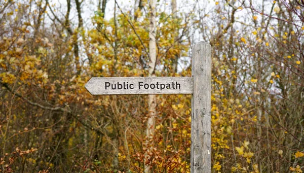 Rural wooden footpath sign, England, United Kingdom