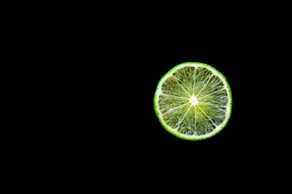 Bright Juicy Lime Wedge Completely Black Background — Stock Photo, Image