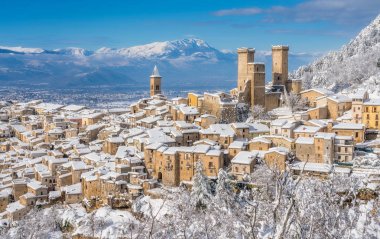 Panoramic view of Pacentro covered in snow during winter season. Abruzzo, Italy. clipart