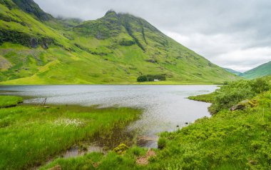 Glencoe, Scottish Highlands bir bulutlu yaz öğleden sonra manzaralı manzara.