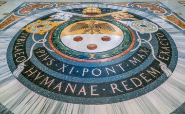Pope Pius XI coat of arms in the floor of Saint Peter Basilica in Rome, Italy. February-16-2018 clipart