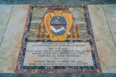 Cardinal coat of arms on the floor of the Church of Santa Maria in Portico in Campitelli in Rome, Italy. January-20-2018