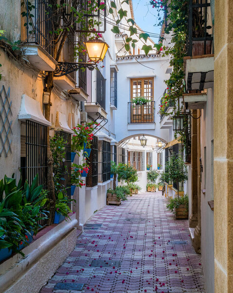 A picturesque and narrow street in Marbella old town, province of Malaga, Spain.