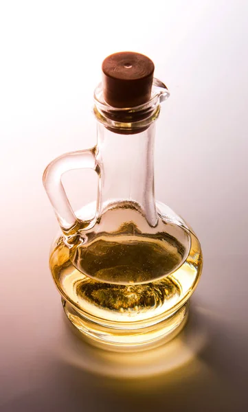 Glass containers for oil with a cork. Backlight. Brown shade. Top side view.