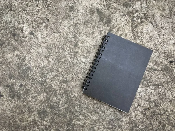 Bovenaanzicht Van Gesloten Zwarte Cover Notebook Verdieping — Stockfoto