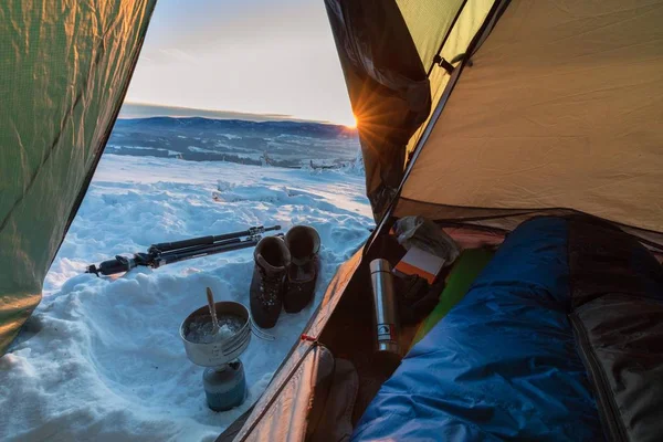 tent on mountain in snow, selective focus