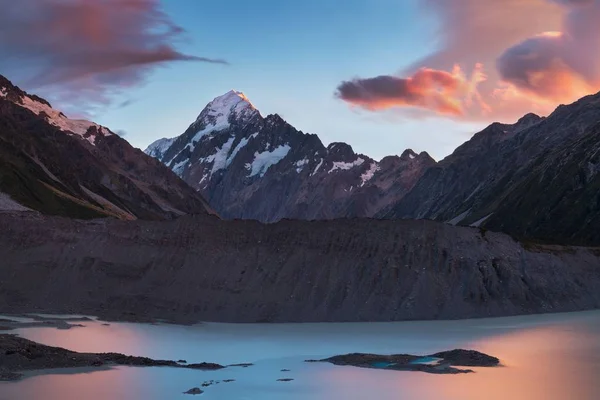 Scenic view of mountains reflecting in water