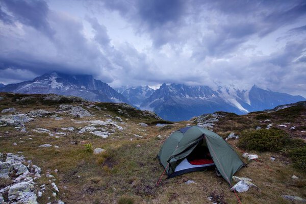 scenic view of tent near mountains at summer