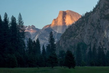 Cathedral Rocks and Cathedral Spires are a prominent collection of cliffs, buttresses and pinnacles located on the south side of the Yosemite Valley in Californias Sierra Nevada Mountains, USA clipart