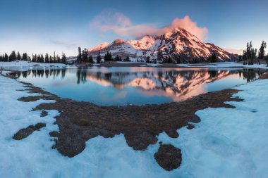 At 10,492 feet high, Mt Jefferson is Oregon's second tallest mountain.Mount Jefferson Wilderness Area, Oregon The snow covered central Oregon Cascade volcano Mount Jefferson rises above a pine forest clipart