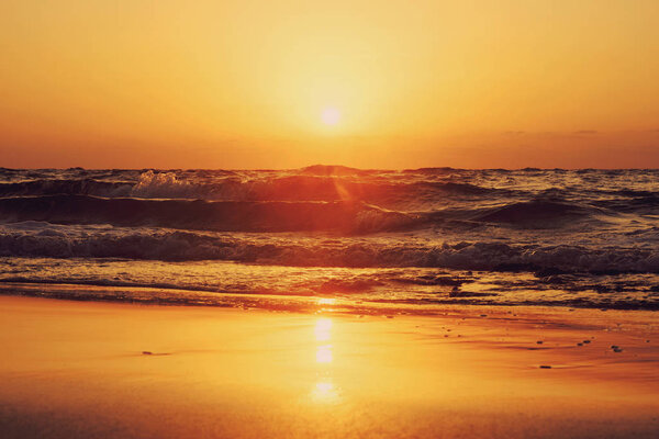 sunset and sun and sky and sea and waves and sand