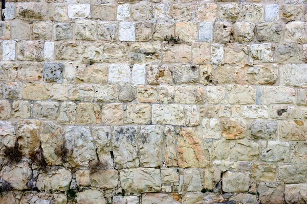 texture of the ancient stone wall of the ancient city