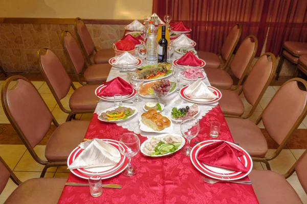 Covered tables in a Russian restaurant in Israel before the birthday celebration