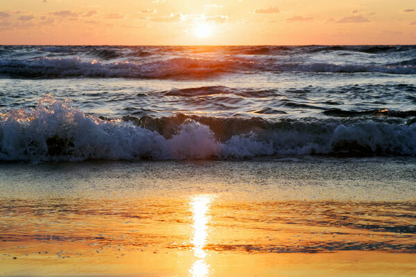 sunset and sun and sea and water and clouds