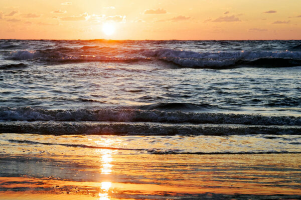 sunset and sun and sea and water and clouds