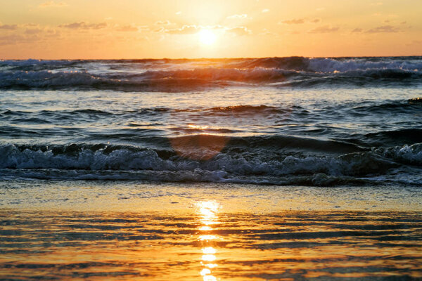 sunset and sun and sea and water and clouds